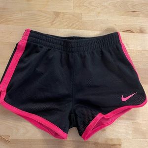 Black and pink Nike athletic shorts